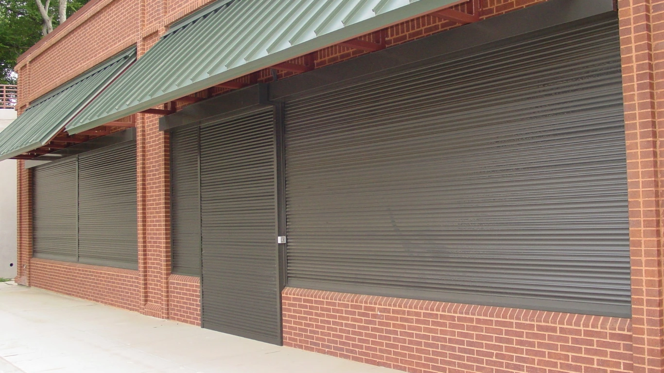 Shades of Texas security shutters - retail storefront installation in Spring