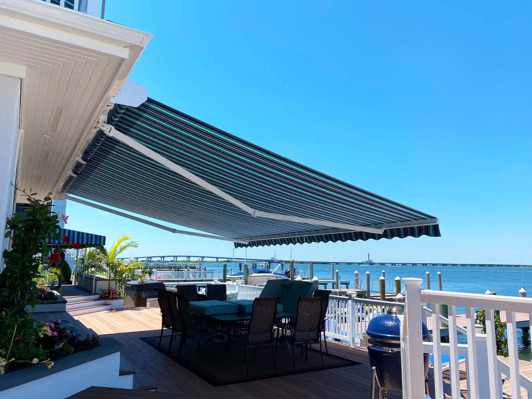 Total Eclipse™ full-cassette retractable awning with LED lighting