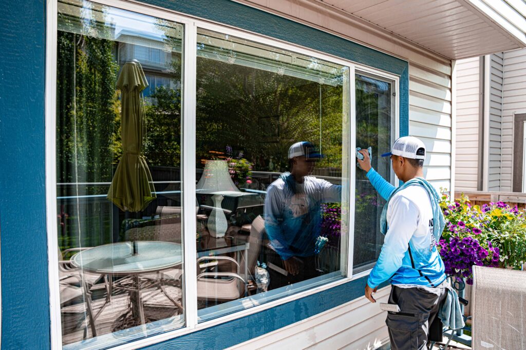 Professional window cleaning technician at work